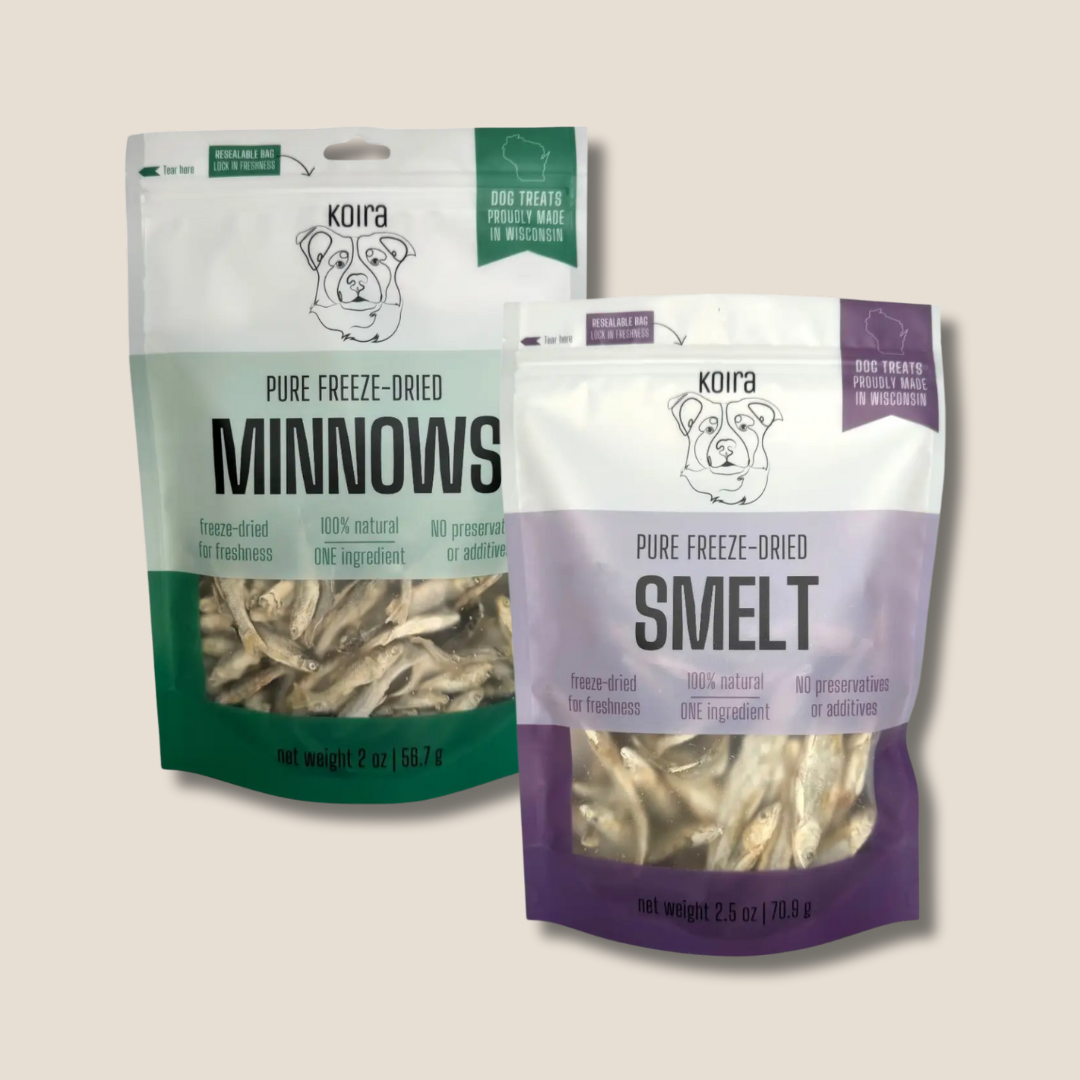 Two packages of Koira pure freeze-dried dog treats, one labeled 'Minnows' and the other 'Smelt', on a light beige background.