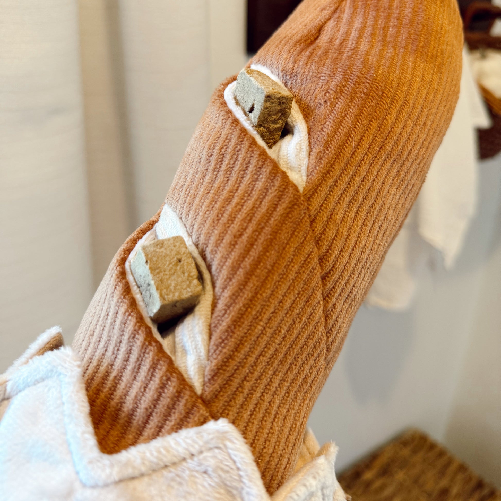 Baguette dog toy with treats in it.